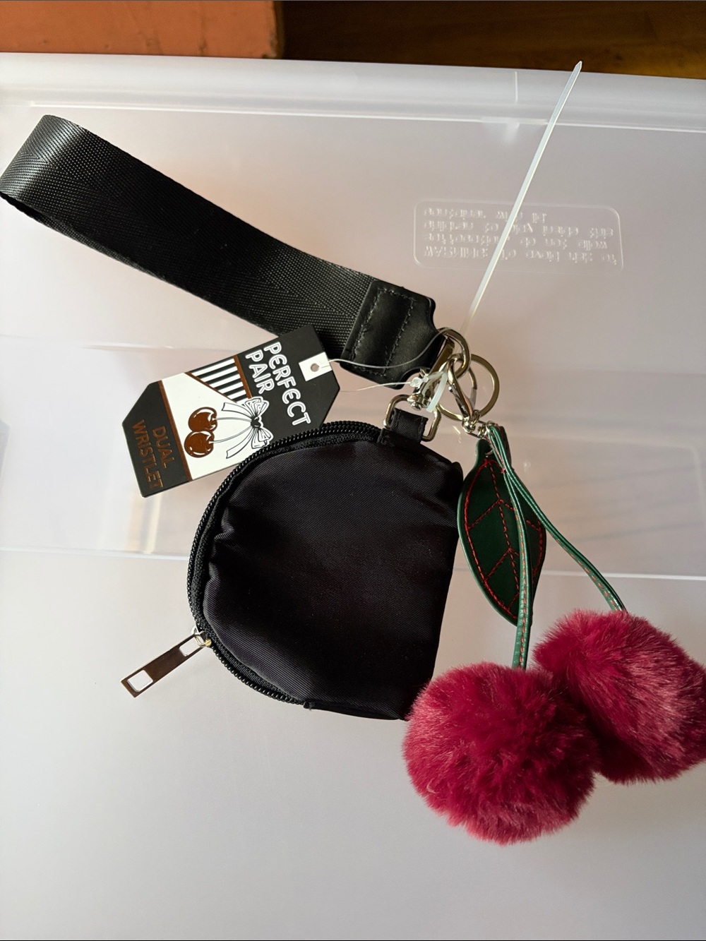 Black Wristlet Coin Pouch with Pink Pom-Pom Charm